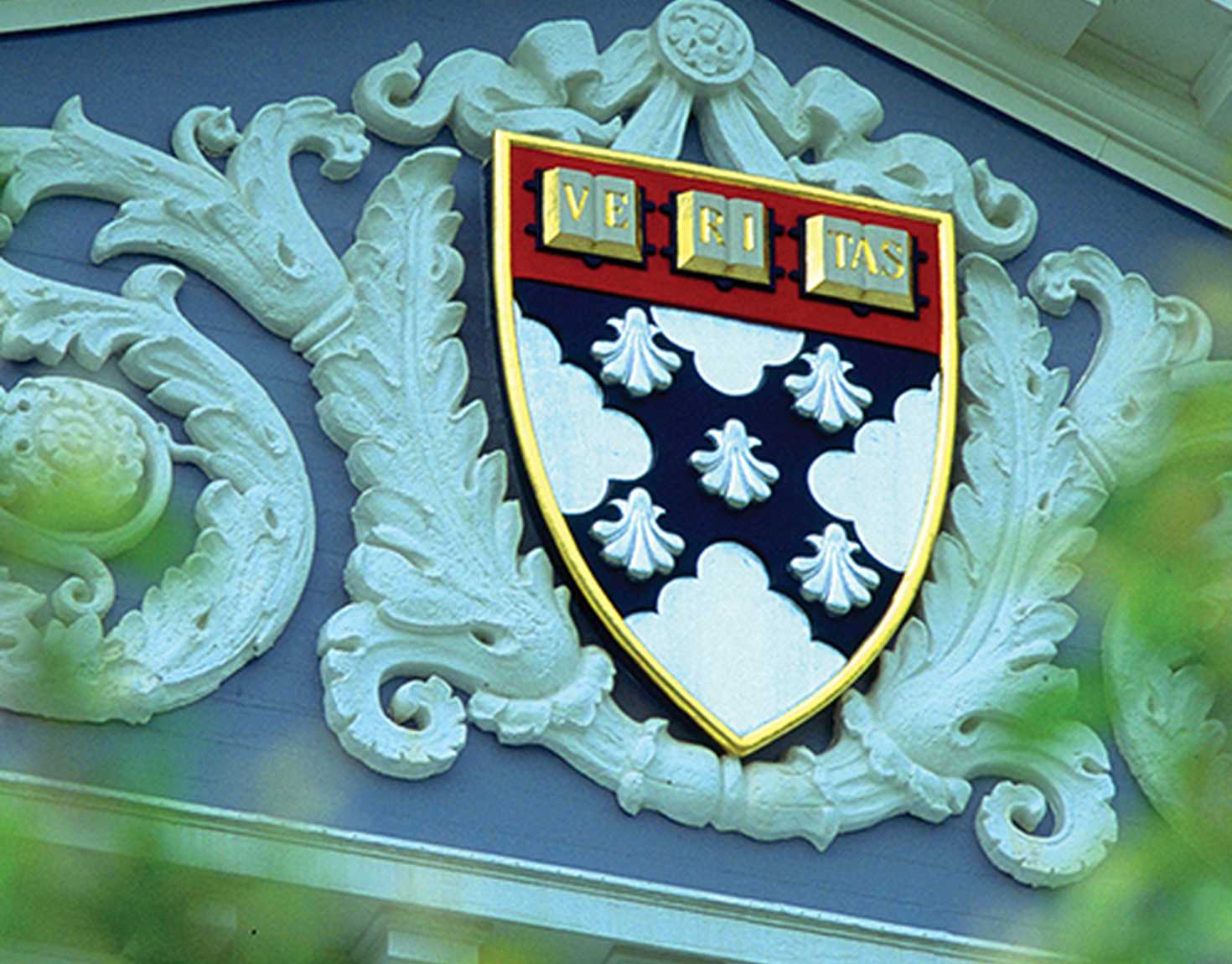 Close up of Harvard Business School coat of arms on top of building